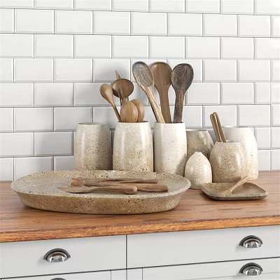 Beige Ceramic Dinnerware Set With Wooden Spoons Oval Plates On Countertop White Brick Wall 3d model