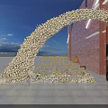 Floral Archway Event Entrance With CINDA CENTER Sign And Red Brick Wall