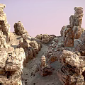 Scenic Natural Landscape With Unique Rock Pillars And Eroded Stone Formations Under Pink Sky