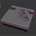Vintage Gray Entertainment Device With Classic Game Cartridges On Top Surface