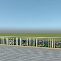 Patterned Metal Railing On Building Exterior Wall With Wooden Deck Green Grassland And Blue Sky