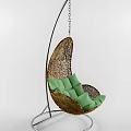 Rattan Hanging Chair With Green Cushion And Woven Design For Comfortable Relaxation