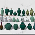 Various Green And White Ceramic Vessels With Decorative Patterns On 3d model