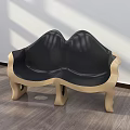 Modern Public Chair With Curved Design Black Leather Seat And Golden Legs On Wooden Floor