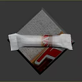 Delicious Chocolate Bar With White Wrapper And Red Gold Accents Placed On Textured Silver Box