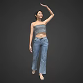 A Woman Wearing Striped Tube Top And Jeans Raising One Arm Against Gray Background