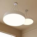 Two Modern Round White Pendant Lights Hanging From Ceiling For Home Interior Design