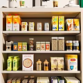 Organized Pantry Shelf Stocked with Various Food Boxes Cans and Jars