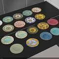 Assorted Colorful Dinnerware Set With Various Patterned Plates On Black Table