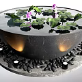 Garden Ornament Circular Stone Bowl With Water Lily Pads Purple Flowers And Black Pebbles