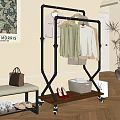 Black Metal Foldable Clothes Rack Holding Multi colored Clothes and Storage Basket