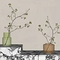 Stylish Glass Vases With Green Leaf Branches On Marble Table With Light Shadows