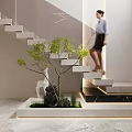 Modern Indoor Staircase Area With Woman Ascending Small Tree Stone Deer Sculpture And Green Plants