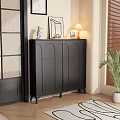 Modern Black Shoe Cabinet With Arched Doors In Entryway With Table Lamp Decorations And Plant