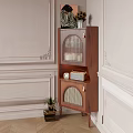 Decorative Walnut Cabinet Featuring Arched Glass Lattice Doors With Candles Radio Clock And Green Plant