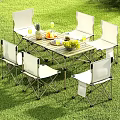 Outdoor Foldable Dining Set With White Chairs Fruits And Glass Cups On Grass