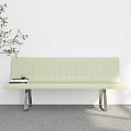 Light Green Outdoor Chair with Metal Legs Next to Plant and Books on Seat