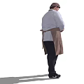 Man Wearing Brown Apron And Blue Shirt Holding Device In Hand Standing