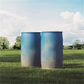 Agricultural Equipment Two Blue Barrels on Green Grass Field with Trees and Sky