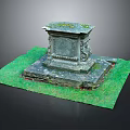 Decorative Stone Pedestal With Moss Covered Top And Carved Details On Green Grass