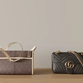 Brown Louis Vuitton Tote And Black Gucci Chain Bags On Wooden Table