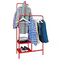 Assorted Clothes on Red Clothing Rack With Plaid Shirts Coat Scarf Striped Items and Shoes