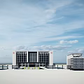 Modern Office Building Complex With Glass Facade Parking Area And Green Space