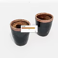 Two Black Ceramic Vessels Featuring Copper Rimmed Edges And Smooth Cylindrical Shape 3d model