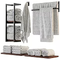 Soft Absorbent Cotton Towels Stacked On Wooden Shelves And Hanging On Racks