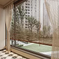 Large Window With Wooden Blinds And Beige Curtains Overlooking Green Trees And Grass