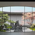 Tranquil Courtyard Garden with Circular Glass Windows Rock Formations Pond Green Grass and Pebbles