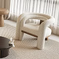 Beige Textured Single Sofa with Curved Armrests Wooden Legs on Neutral Rug and Side Table