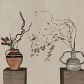 Rustic Striped and Minimalist Gray Vases with Dried Branches on Wooden Stumps Against Neutral Beige Wall