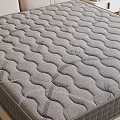 Comfortable Mattress With Wave Pattern Design On Modern Bed Frame And Nightstand