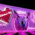 Valentine's Day Photo Spot with Neon Wings Heart Decoration and Pink Checkerboard Floor