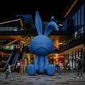 Giant Blue Rabbit Inflatable Installation In Urban Commercial Plaza With People