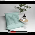 Light Green Bean Bag Sofa With Small Side Table Book And Potted Plant