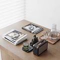 Stylish Decorative Accessories Set on Wooden Table with Magazines Vintage Radio Glass Carafe and Cups