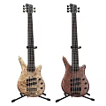 Two Stylish Electric Bass Guitars With Light Dark Wood Grain Curved Body Design And Strings