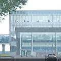 Modern Office Building With Glass Facade Stone Base And Tree Near Entrance With Cars