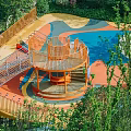 Colorful Outdoor Children's Play Area With Climbing Structure Slide And Green Surroundings