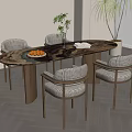 Oval Dining Table Set With Woven Chairs Fruit Plate And Green Plant Decor