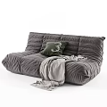 Gray Velvet Sectional Sofa With Green Pillow And Gray Blanket