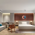 Elegant Modern Hotel Room Interior With King Bed Circular Wall Decor And Sofa Area