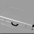 Silver Metal Briefcase With Black Handle And Sleek Reflective Surface On Black Background