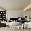 Modern Living And Dining Area With Navy Blue Sofa Round Coffee Table And Bookshelf