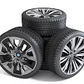 Stacked Car Tires With Stylish Metallic Wheel Rims And Tread Pattern Design