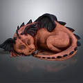 Sleeping Dragon Sculpture With Brown Body Black Wings And Spines