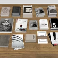 Collection of Books and Magazines with Various Covers on Wooden Floor