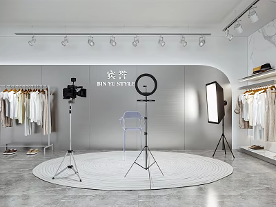 Public Office Space Featuring Clothing Racks Cameras Ring Lights And Round Grey Carpet 3d model